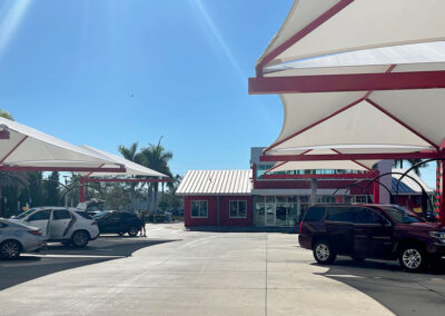 Multiple cars in car wash vacuum area